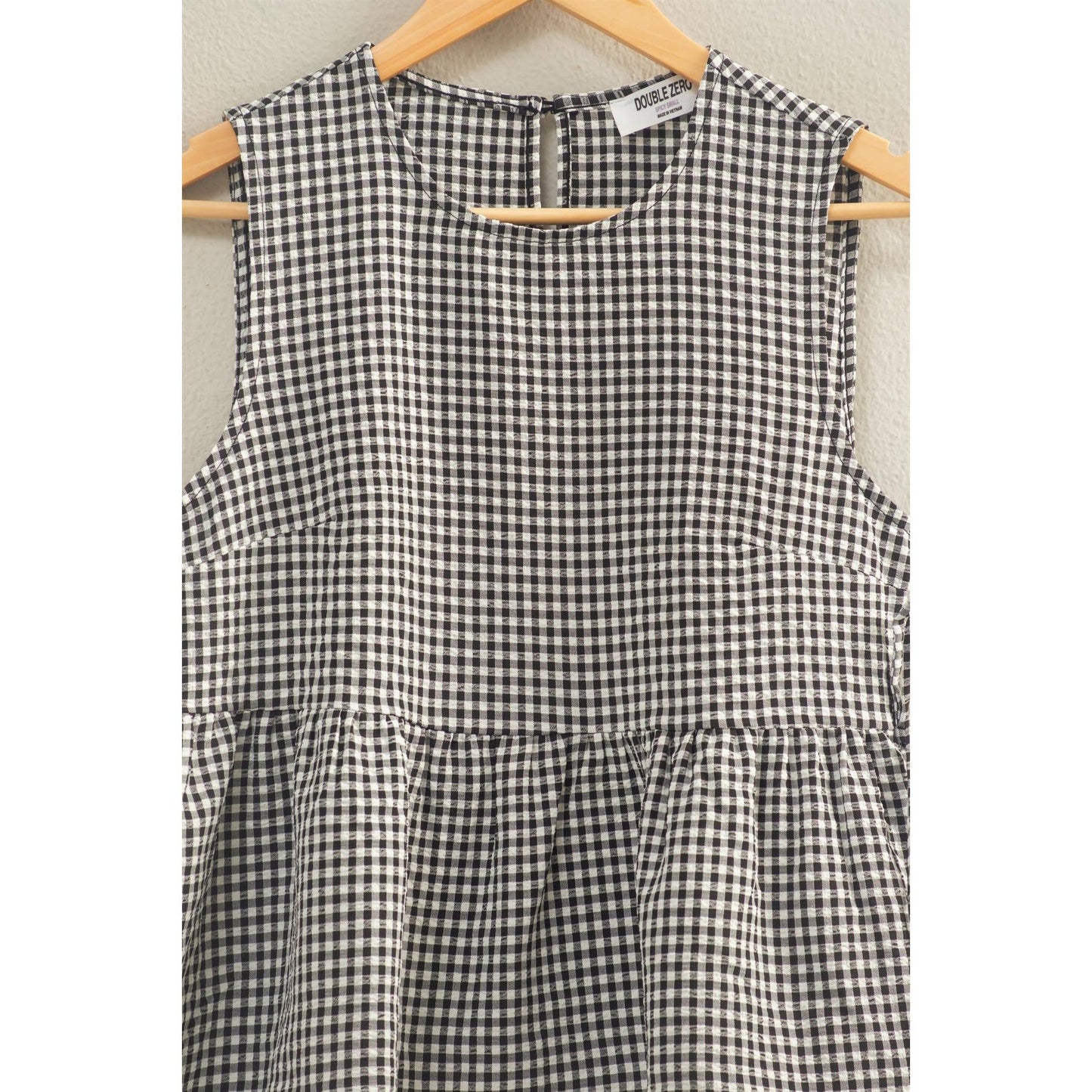 Gingham Sleeveless Peplum Top With Side Ties: BLACK
